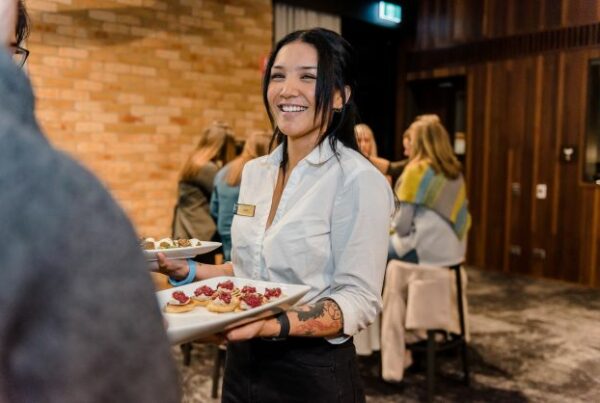 Photo of a wait staff serving food at a conference in Victoria